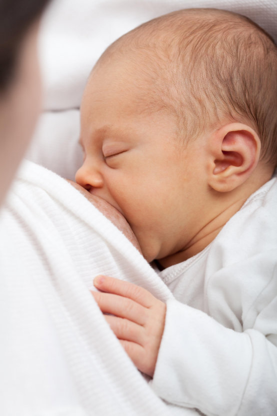 mom breastfeeding infant